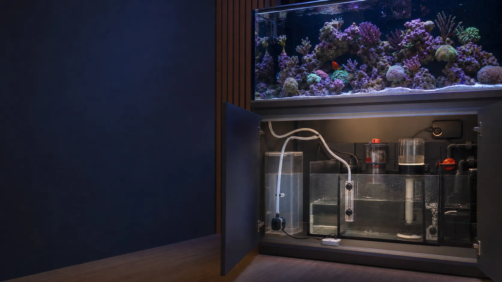 Reef aquarium cabinet with an auto top-off reservoir, optical level sensor, dosing pump, tubing, and leak detector
