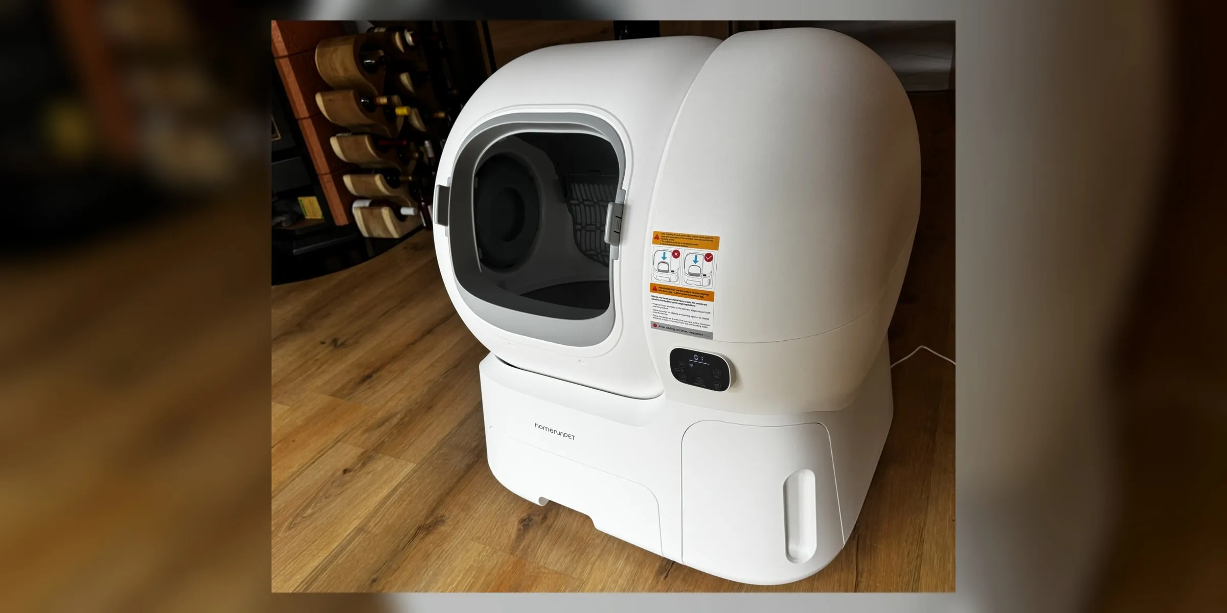 homerunPET CS106 self-cleaning litter box photographed from a front angle with the full unit visible